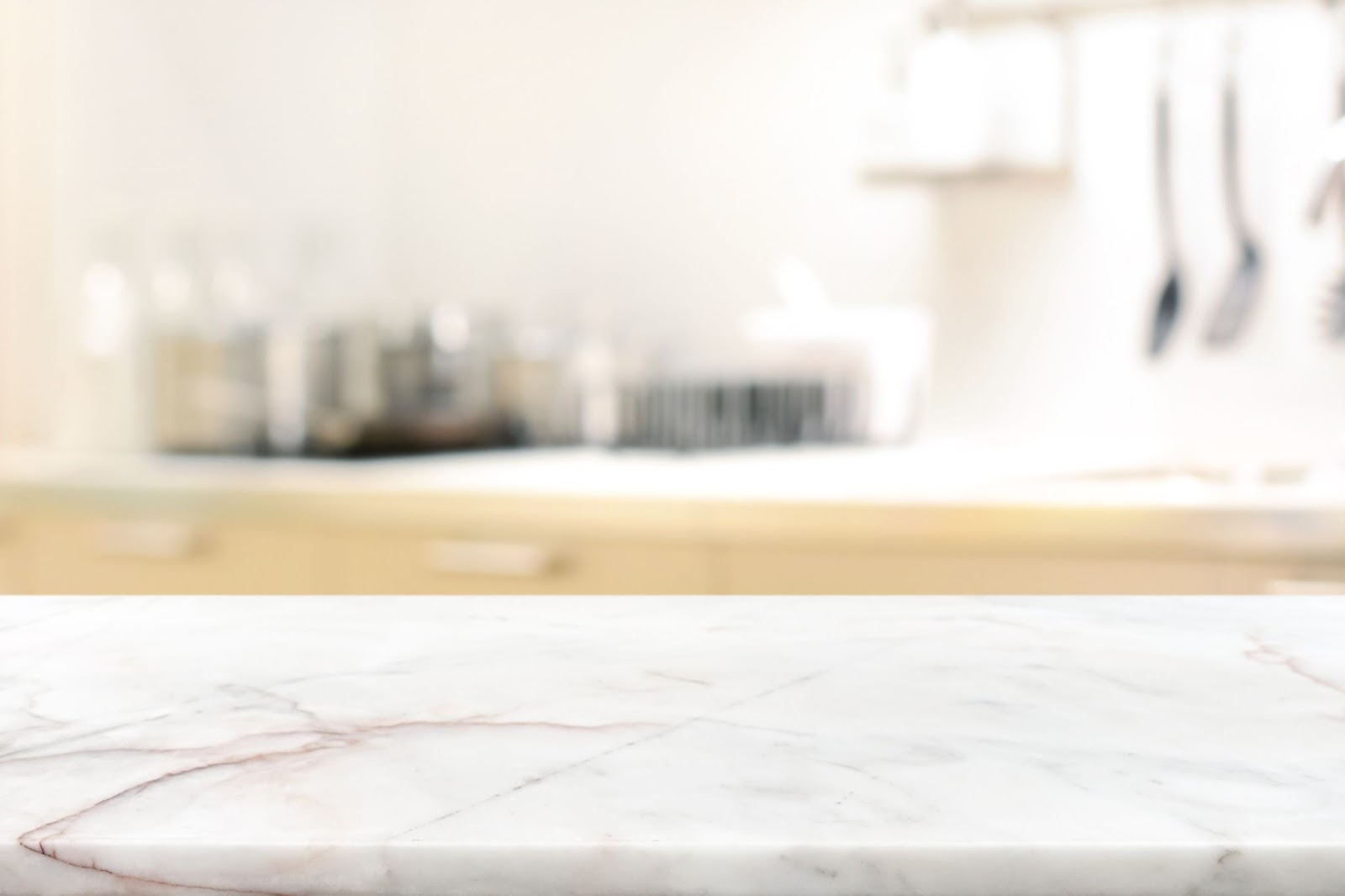 A close up image of a marble countertop with an out of focus background.